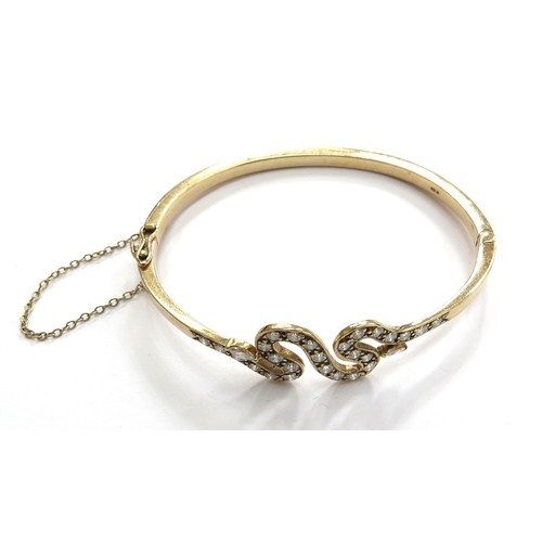 6014 - A diamond hinged bangle with snake like design, stamped 375, 18.7g