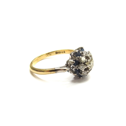 6062 - An 18ct gold platinum set sapphire and diamond cluster ring. Size Q, 4.2g