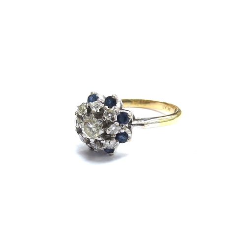 6062 - An 18ct gold platinum set sapphire and diamond cluster ring. Size Q, 4.2g