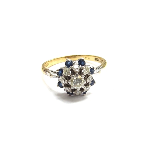 6062 - An 18ct gold platinum set sapphire and diamond cluster ring. Size Q, 4.2g