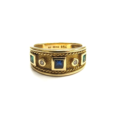 6044 - An 18ct gold band with square sapphire flanked by round diamonds and square emeralds all in raised c... 
