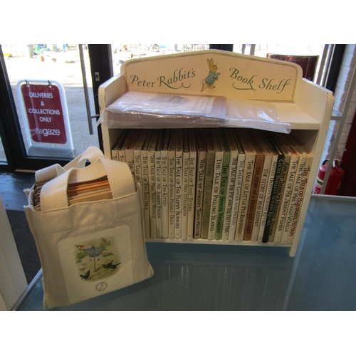 A Peter Rabbit's bookshelf with complete set of books including early ...