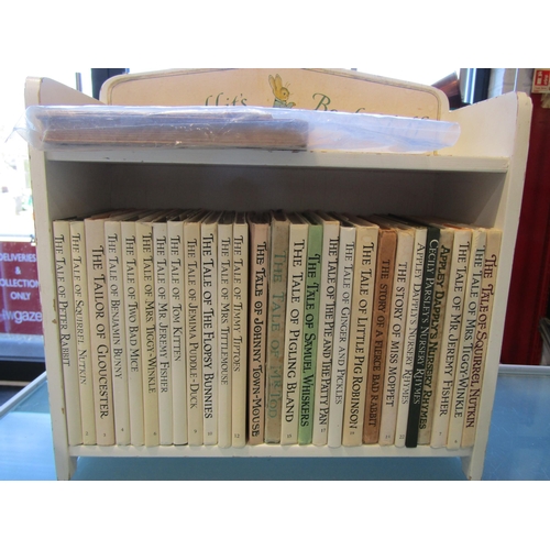 A Peter Rabbit's bookshelf with complete set of books including early ...