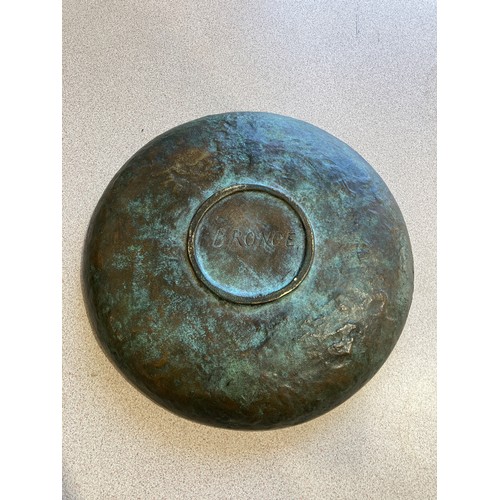 1013 - A 20th Century bronze charger, mottled relief with central horse roundel, marked 'Bronce' to reverse... 