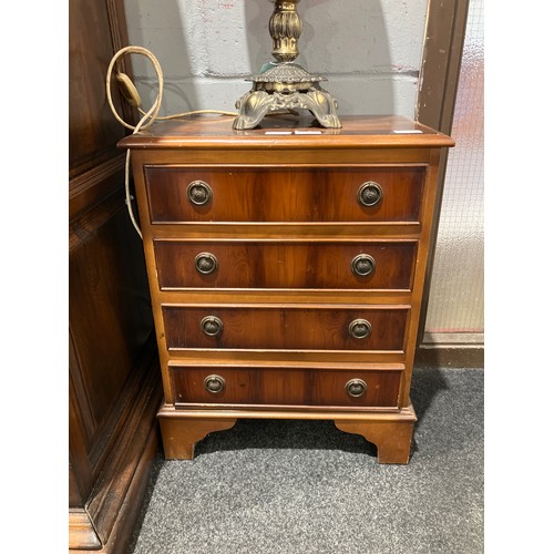 1038 - A pair of 20th Century yew wood miniature chests of four drawers, 63cm tall x 49cm wide x 31cm deep