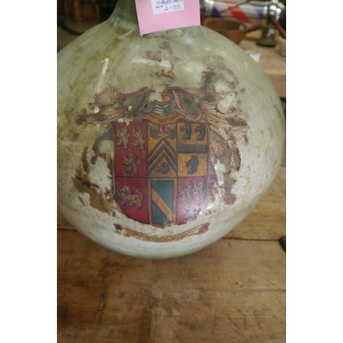 2002 - A green glass carboy with painted armorial crest, 50cm tall