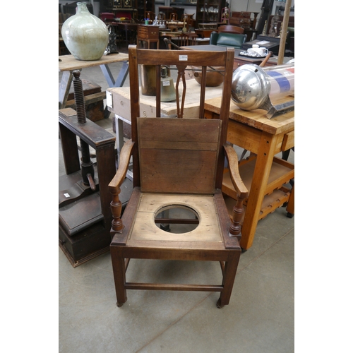 2016 - An early 19th Century ash country elbow chair with lift seat