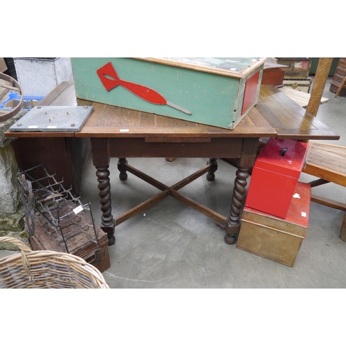 2037 - A 20th Century oak draw leaf table, barley twist legs, cross stretcher