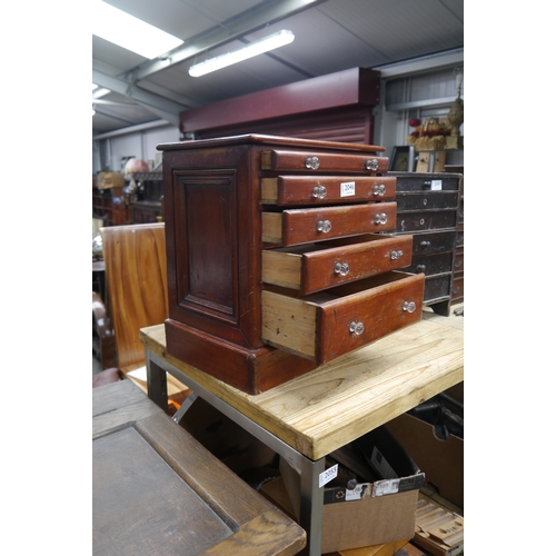 2046 - A Victorian mahogany miniature table top five drawer chest of drawers, glass knobs (one a/f)