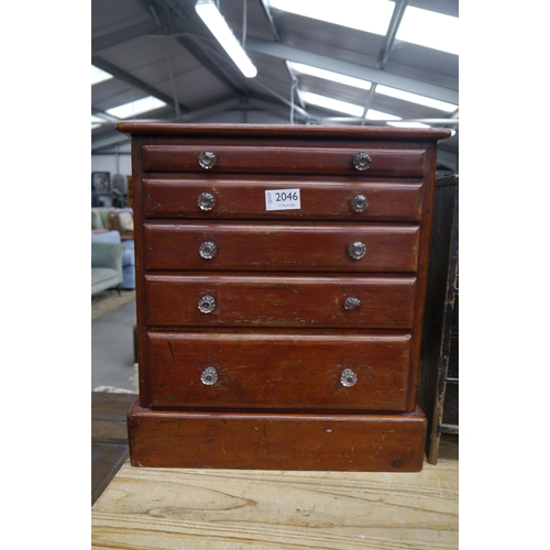 2046 - A Victorian mahogany miniature table top five drawer chest of drawers, glass knobs (one a/f)