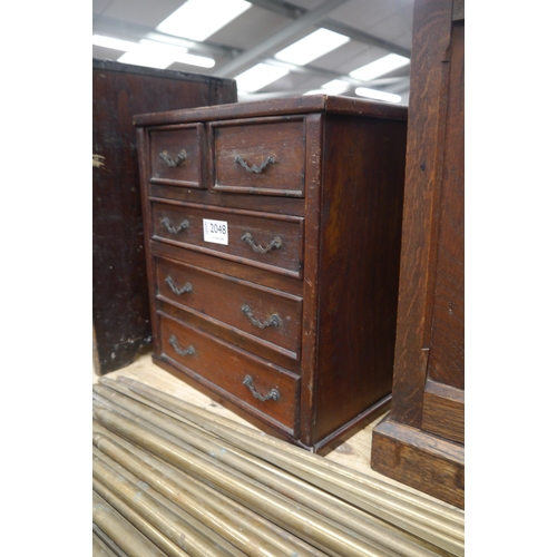 2048 - An apprentice miniature two over three drawer chest of drawers