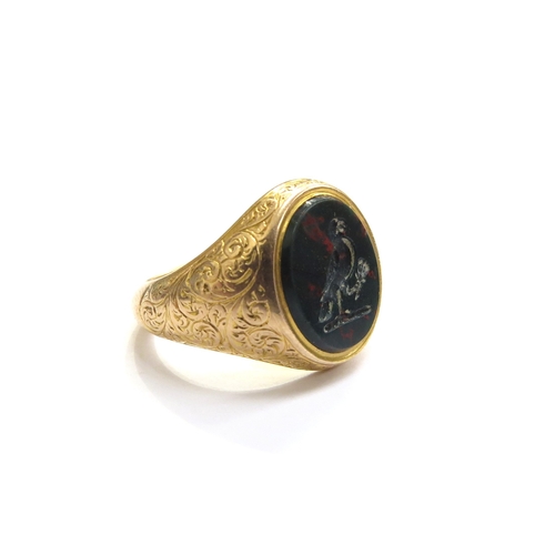 6049 - An 18ct gold bloodstone intaglio signet ring depicting a bird with sprig of foliage in its claw, fin... 