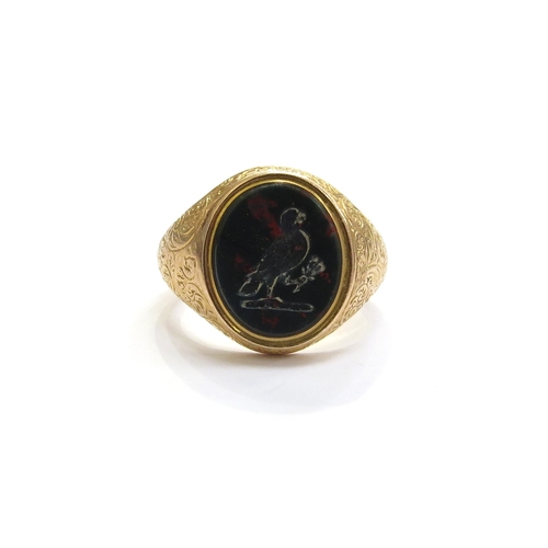 6049 - An 18ct gold bloodstone intaglio signet ring depicting a bird with sprig of foliage in its claw, fin... 