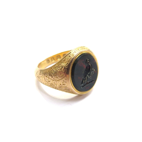 6049 - An 18ct gold bloodstone intaglio signet ring depicting a bird with sprig of foliage in its claw, fin... 
