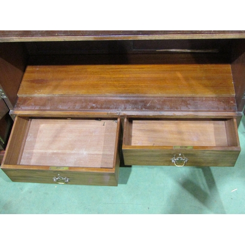 4044 - A Georgian mahogany bookcase, two arch top glazed doors and two drawers over bracket feet, with key,... 