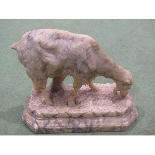 4058 - A carved alabaster figure of a grazing goat on stand, a/f repaired breaks to legs, 18cm tall