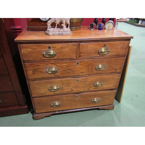 4060 - A George III figured oak chest of two short over three long drawers, oval brass handles on bracket f... 