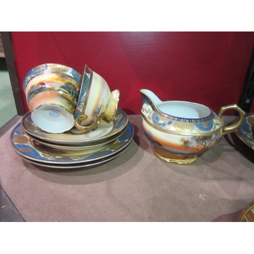 4004 - A Noritake part tea set and six Oriental cups and saucers with character marks to base, one cup a/f