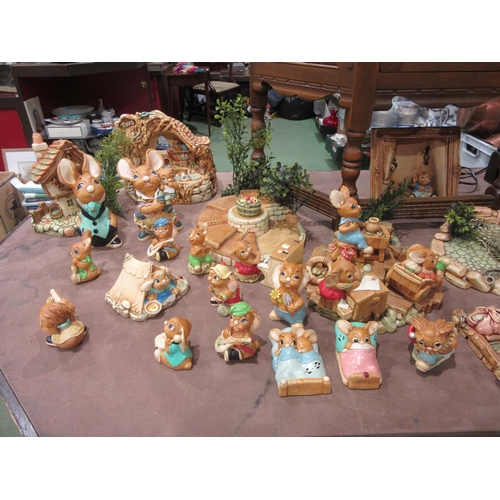 4005 - A large quantity of Pendelfin figures and settings including various stands, large house etc.