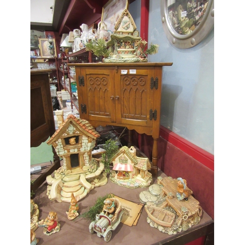 4005 - A large quantity of Pendelfin figures and settings including various stands, large house etc.