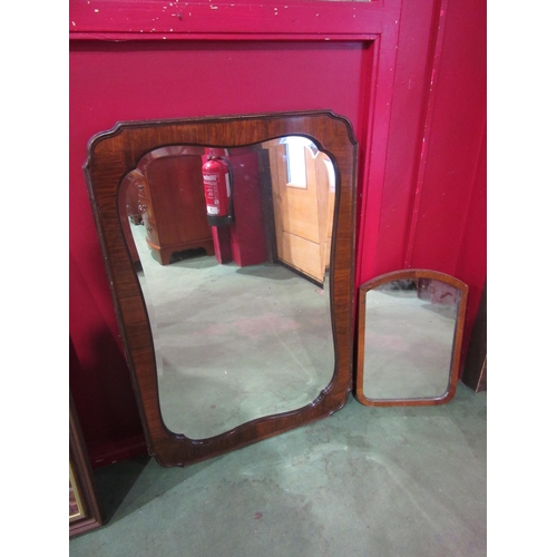 4012 - A 1940's shaped wall mirror, bevel edged, 85cm x 59cm and a smaller example 43cm x 30cm (2)