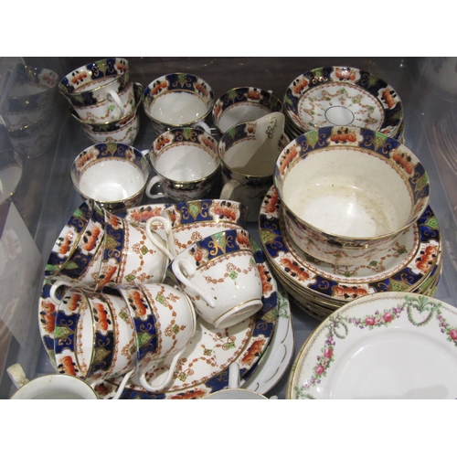 A Newhall style tea set and an imari palette tea set