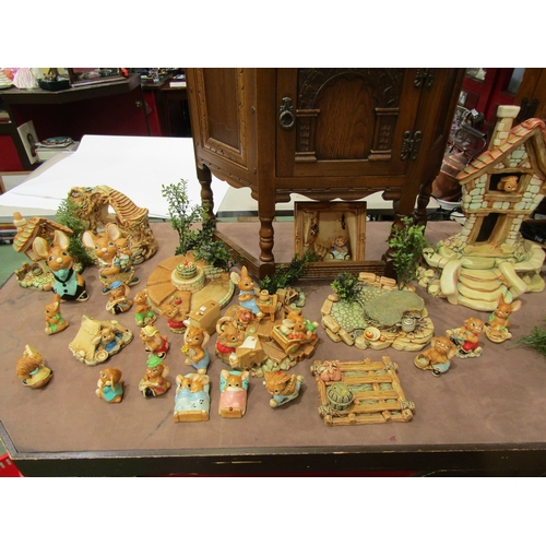 4005 - A large quantity of Pendelfin figures and settings including various stands, large house etc.