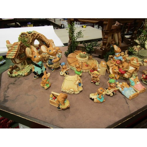 4005 - A large quantity of Pendelfin figures and settings including various stands, large house etc.