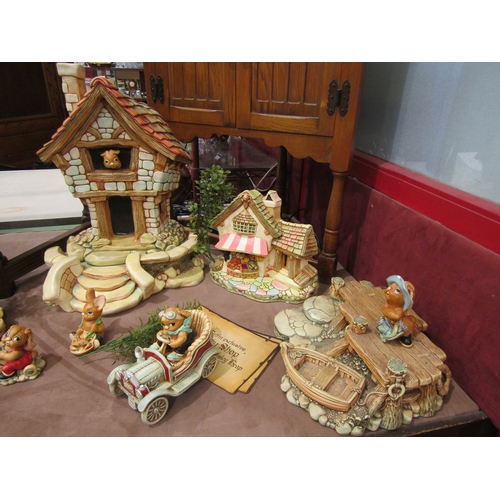 4005 - A large quantity of Pendelfin figures and settings including various stands, large house etc.