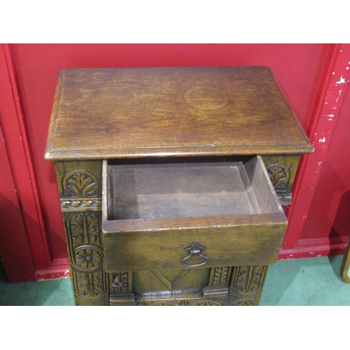 4011A - A 17th Century and later carved oak cabinet of small proportions, the single drawer over a single do... 