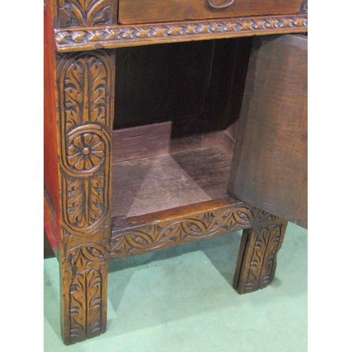 4011A - A 17th Century and later carved oak cabinet of small proportions, the single drawer over a single do... 