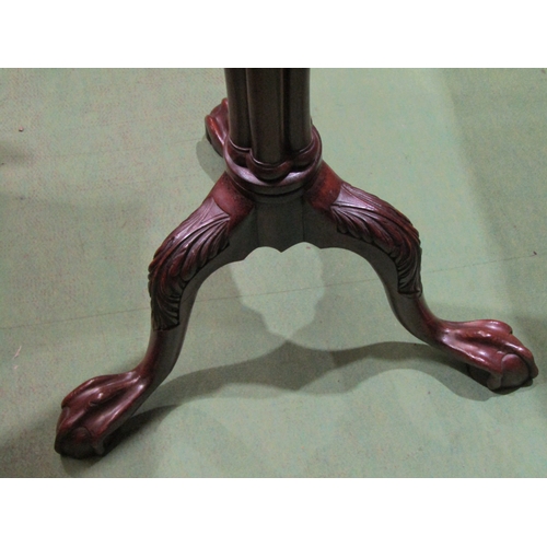 4036 - A Georgian mahogany torchere stand, the circular top over a pillar column on an acanthus leaf carved... 