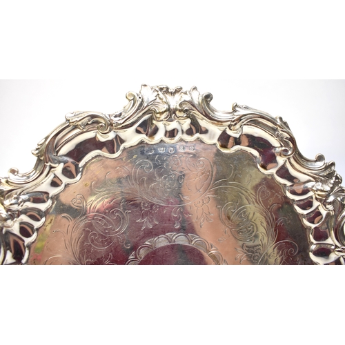 8020 - A Victorian silver salver with shaped acanthus scrolling border, vacant central cartouche 26cm diame... 