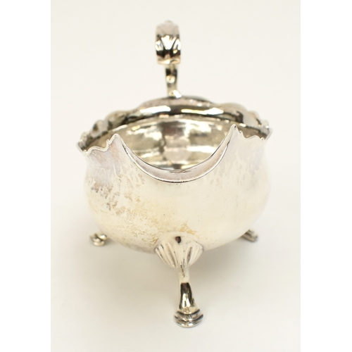 8028 - A Stephen Adams I, Stephen Adams II George III silver sauce boat/cream jug, London 1767, monogram EC... 