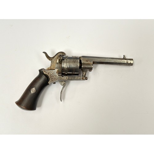 A 19th Century pinfire revolver, engraved scrolled foliate detail ...