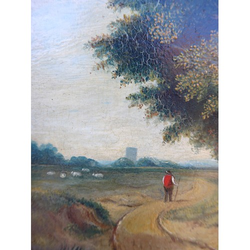 9019 - A 19th Century oil on panel, figure on a country path, pastoral scene beyond and church tower in dis... 