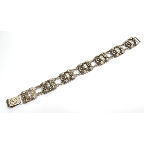 6546 - A Danish silver seven panel bracelet by Erik Niels From, 19.5cm long