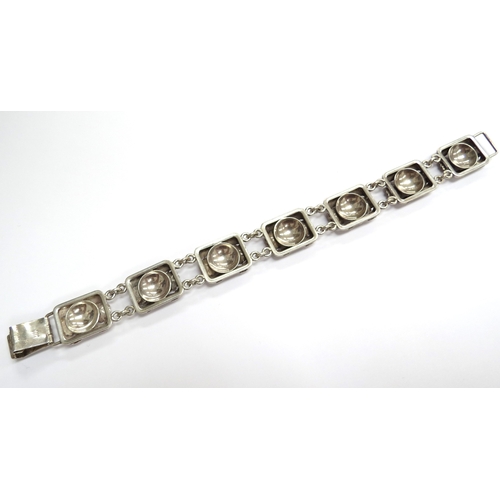 6546 - A Danish silver seven panel bracelet by Erik Niels From, 19.5cm long