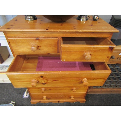 A pine chest of drawers, two short over four long drawer, bun handles ...