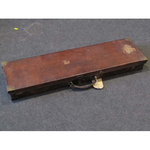 1023 - A Cogswell & Harrison Ltd., London, leather shotgun case with assortment of cleaning kit