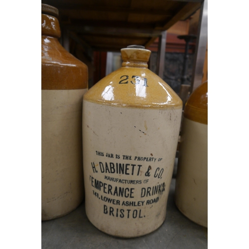 2041 - Three stoneware flagons, Whyte way Devon cider, H.Dabinett &co etc