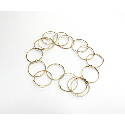 6519 - An unmarked gold puzzle ring, 7.1g