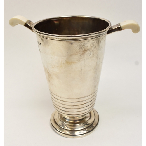 8007 - A silver presentation wine cooler ice bucket of Deco form by Barker Brothers Silver Ltd., Bakelite h... 