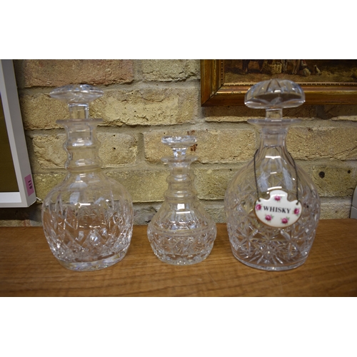 4408 - A Stuart Crystal ring necked decanter, a crystal decanter with ceramic whisky label and a small Stua... 