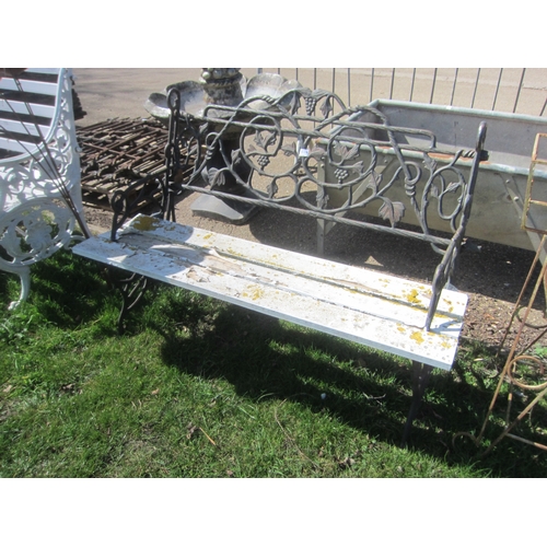 5024 - A cast iron ended and back ivy leaf bench, wooden slats