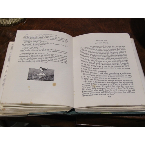 4028 - A collection of eleven Arthur Ransome books, all ex-library, some with dust jackets