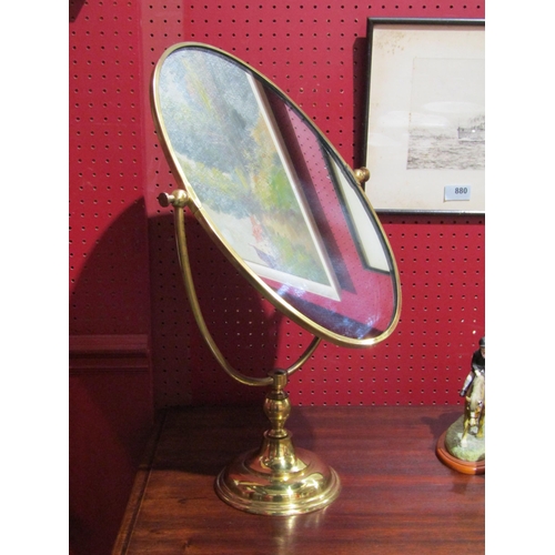 4055 - An oval brass dressing chest mirror, 56cm tall