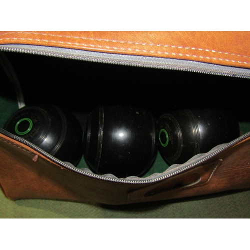 4058 - A set of four Thomas Taylor Glasgow size 4 lawn bowls