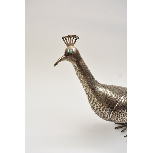 8035 - A Persian silver figure of a peacock, engraved feather detail, character marks to underside, 19.5cm ... 