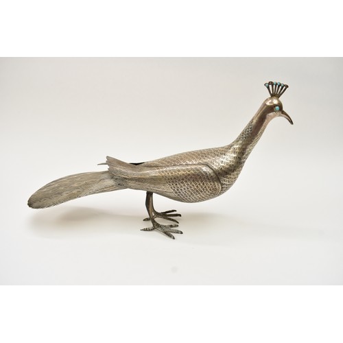 8035 - A Persian silver figure of a peacock, engraved feather detail, character marks to underside, 19.5cm ... 